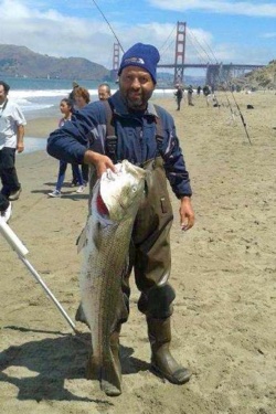 California Beach Surf Fisherman with Striper